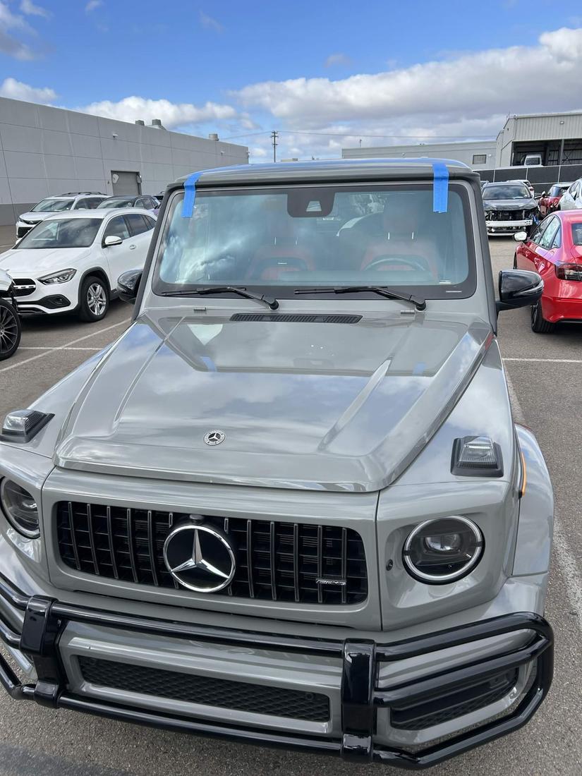 Mercedes-AMG G-Wagon with a new windshield installed, alignment tape in place during cure time